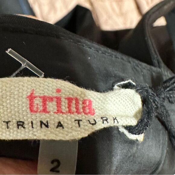 C17- Trina Turk black dress with elegant details to accentuate fit . - Picture 6 of 6